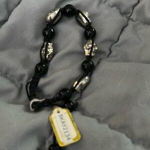 NWT Metal Skulls  beads and rope bracelet